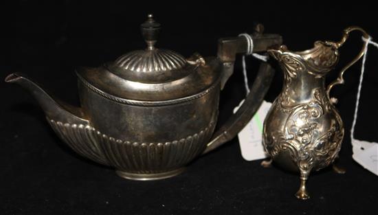 A George II embossed silver helmet-shaped cream jug, London 1758, Frederick Vonham and a Mappin & Webb small silver teapot.